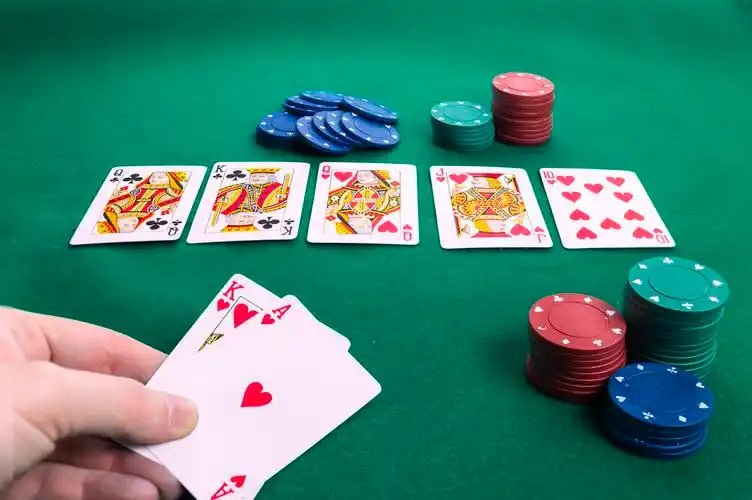 ssbet77 Live Casino dealer table streamed on a Filipino player's mobile phone